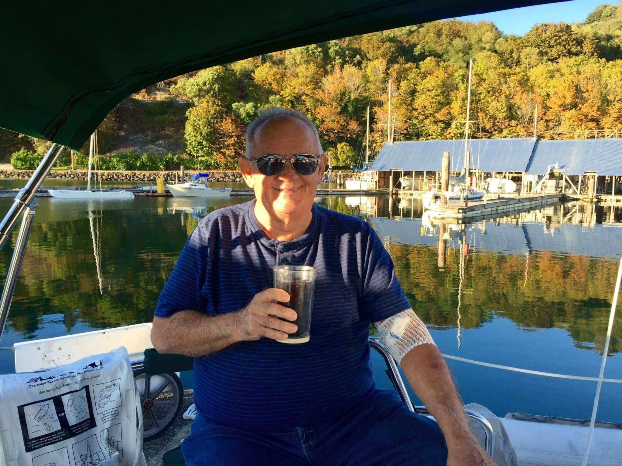 Dick enjoying a drink in Grace's cockpit.