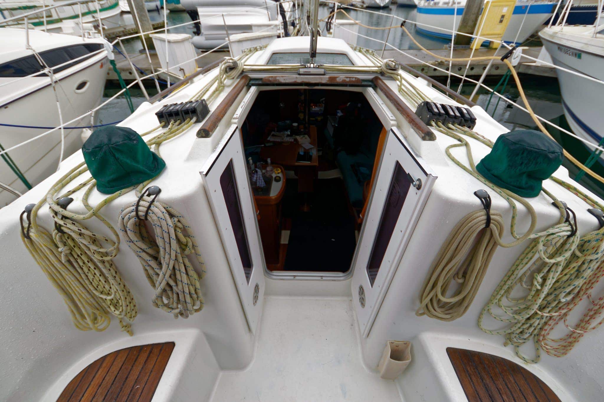 Doors open easily and fold against the companionway