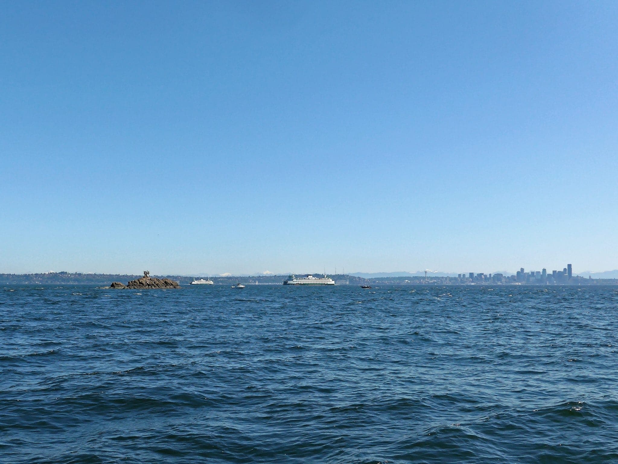 Blakeley Rocks with Bainbridge Ferries in background and Seattle